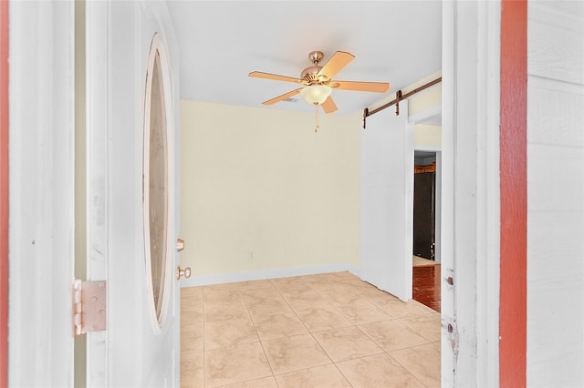 tiled empty room with ceiling fan