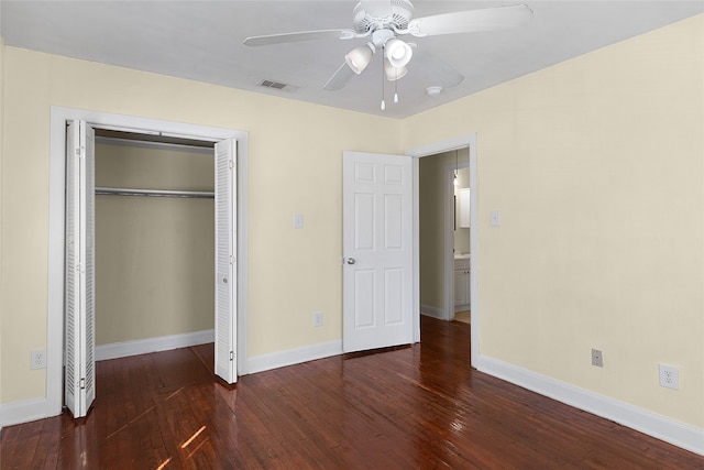 unfurnished bedroom with a closet, ceiling fan, and dark hardwood / wood-style flooring