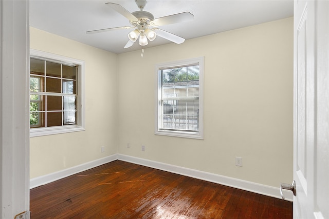 spare room with ceiling fan and hardwood / wood-style flooring