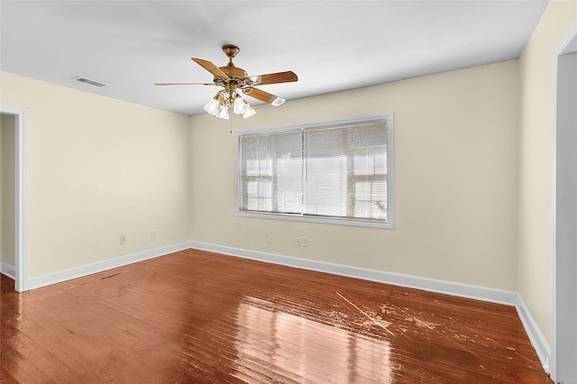 spare room with ceiling fan and hardwood / wood-style flooring