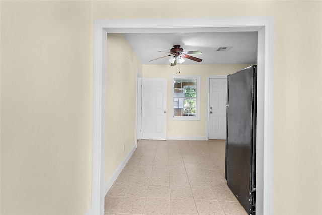 hallway with light tile patterned flooring