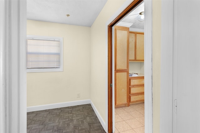 corridor featuring a textured ceiling and parquet floors