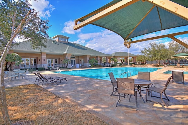 view of swimming pool with a patio area