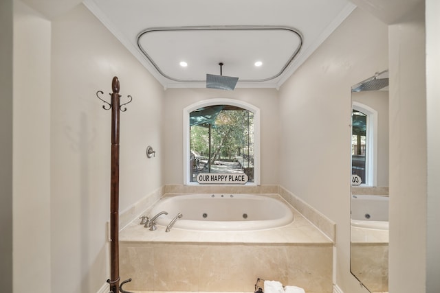 bathroom with ornamental molding and tiled tub