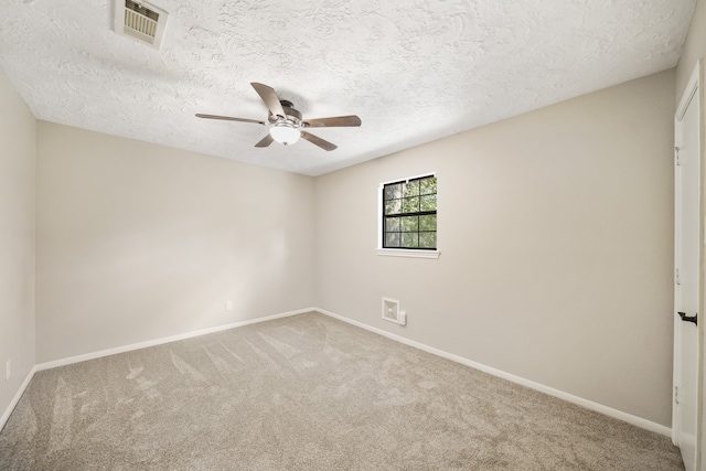 carpeted empty room featuring a textured ceiling and ceiling fan