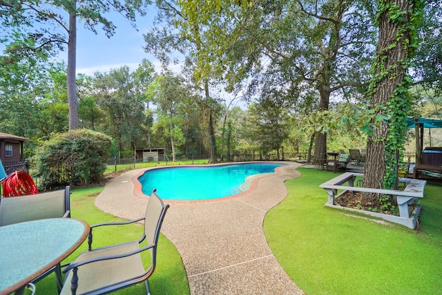 view of swimming pool with a patio and a yard