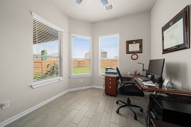 office featuring ceiling fan and light hardwood / wood-style flooring