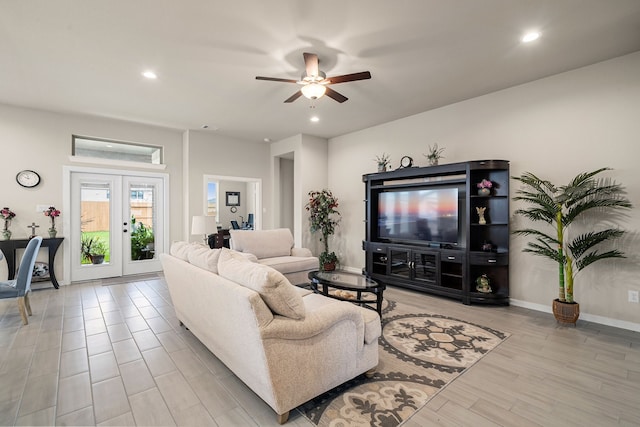 living room featuring french doors, light wood-type flooring, and ceiling fan