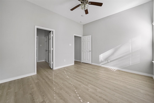 empty room featuring light wood-type flooring and ceiling fan