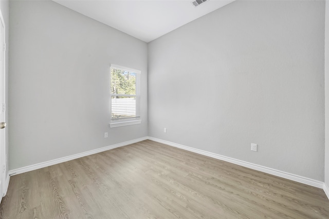 unfurnished room with light hardwood / wood-style flooring