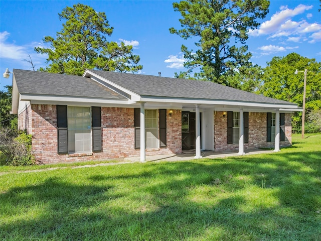 ranch-style home featuring a front yard