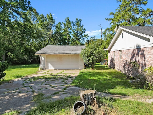 garage featuring a lawn