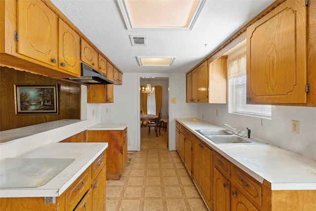 kitchen featuring a notable chandelier and sink