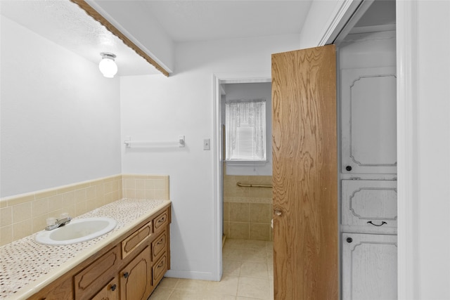 bathroom featuring tile patterned flooring and vanity