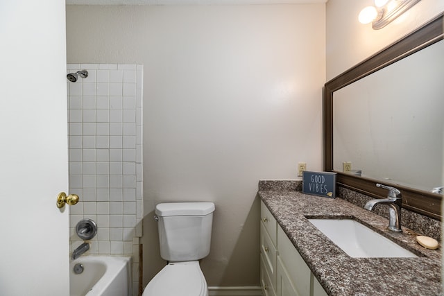 full bathroom with tiled shower / bath combo, vanity, and toilet