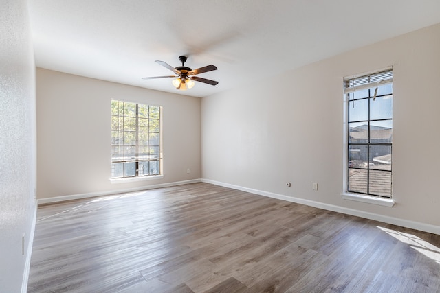 unfurnished room with ceiling fan and light hardwood / wood-style flooring