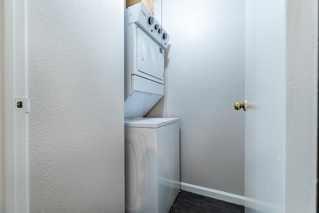 laundry room with stacked washer / dryer