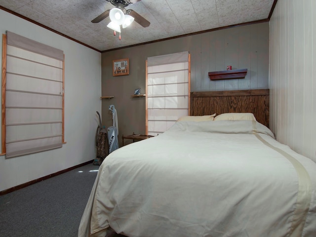 carpeted bedroom featuring ceiling fan and ornamental molding