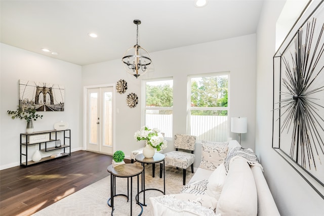 living room featuring dark hardwood / wood-style floors and a chandelier