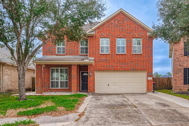 traditional-style home featuring an attached garage, fence, concrete driveway, and brick siding