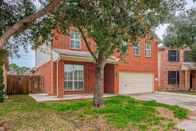 view of front of home featuring brick siding, concrete driveway, an attached garage, a front yard, and fence