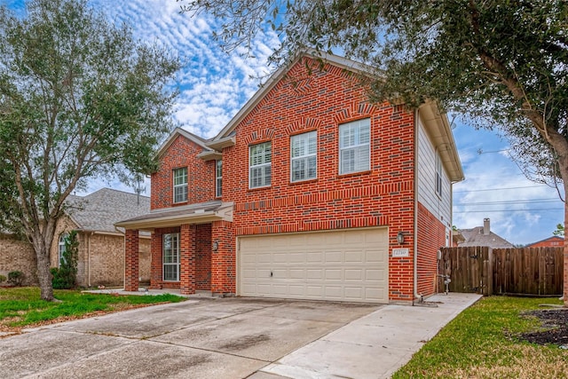 traditional home with an attached garage, brick siding, fence, driveway, and a front yard