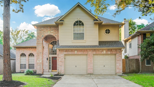 view of front of home featuring a front lawn and a garage