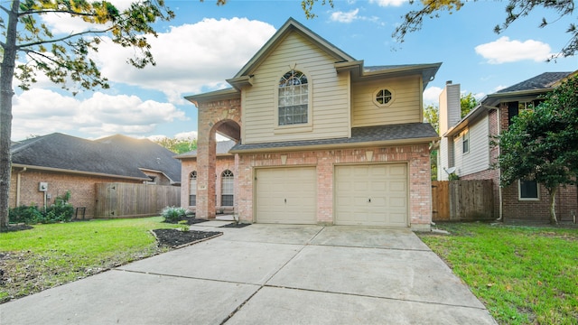 view of front property featuring a front yard and a garage