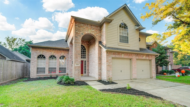 view of front facade with a garage and a front yard