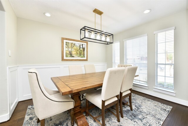 dining space with dark wood-type flooring