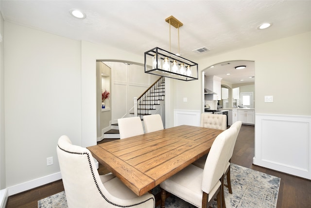 dining area with dark hardwood / wood-style floors