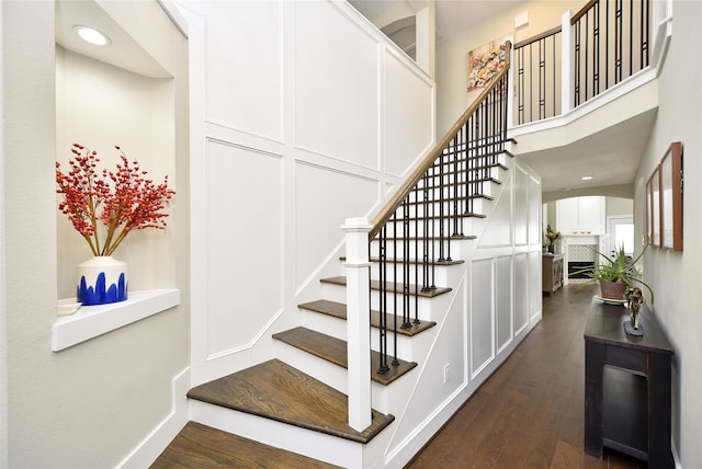 stairway with hardwood / wood-style flooring