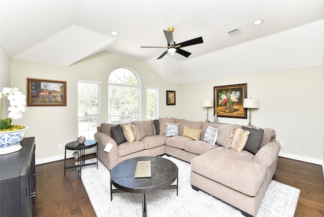 living room with ceiling fan, lofted ceiling, and dark hardwood / wood-style floors