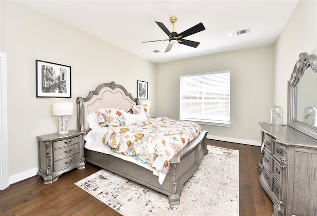 bedroom with ceiling fan and dark hardwood / wood-style flooring