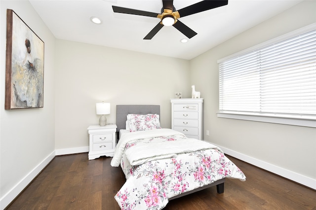 bedroom with ceiling fan and dark wood-type flooring