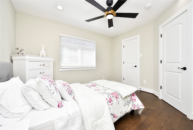 bedroom featuring dark wood-type flooring and ceiling fan