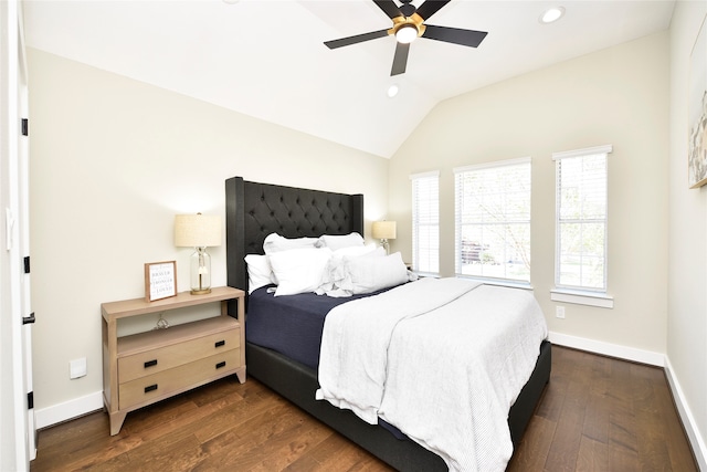 bedroom with lofted ceiling, ceiling fan, and dark wood-type flooring