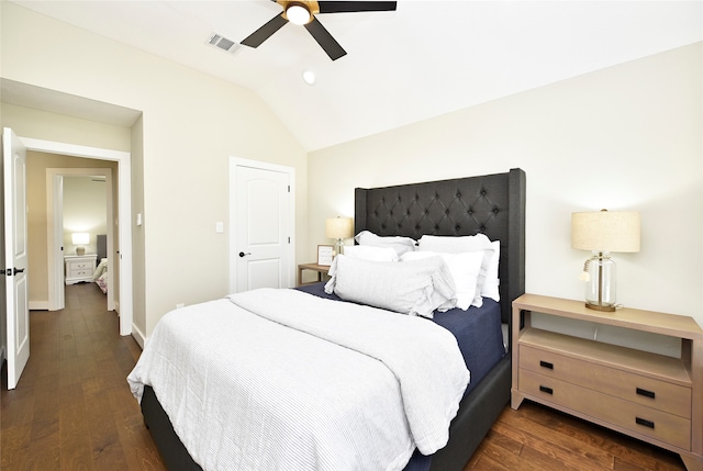 bedroom with vaulted ceiling, dark hardwood / wood-style floors, and ceiling fan