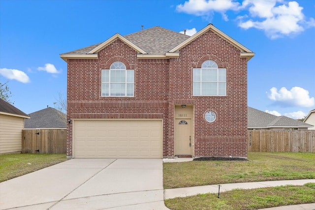 view of front property with a front lawn and a garage