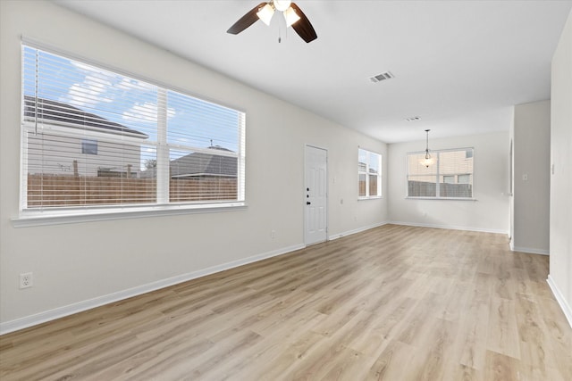 unfurnished living room with light hardwood / wood-style flooring and ceiling fan