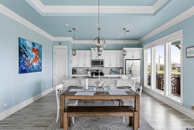 dining space with crown molding and dark hardwood / wood-style flooring