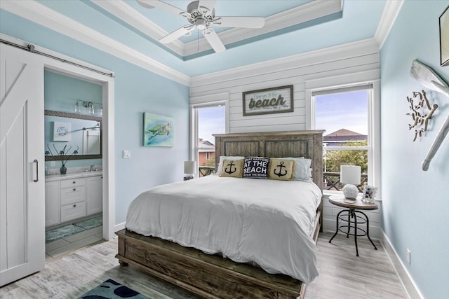 bedroom with light hardwood / wood-style flooring, multiple windows, ceiling fan, and crown molding