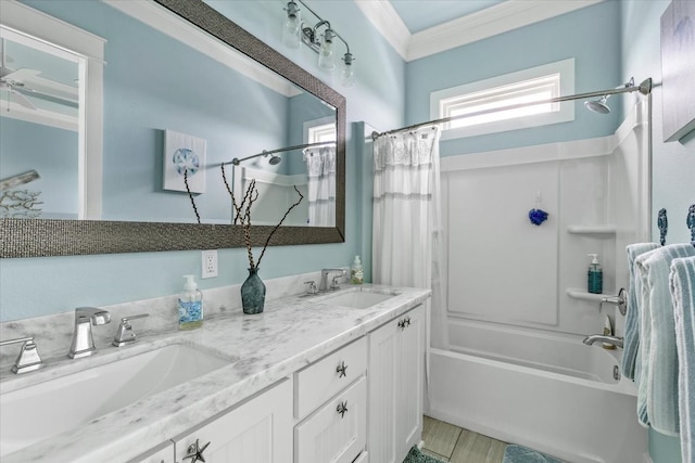 bathroom featuring shower / bath combination with curtain, vanity, and crown molding