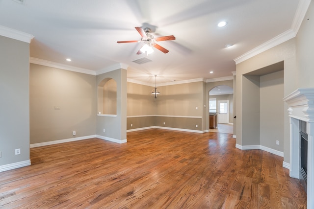 unfurnished living room featuring ornamental molding, ceiling fan, and hardwood / wood-style flooring