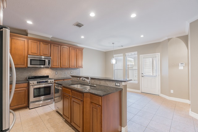 kitchen with sink, light tile patterned floors, stainless steel appliances, and tasteful backsplash