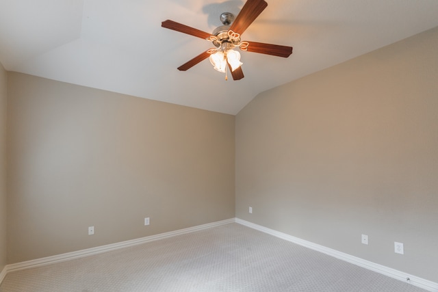 carpeted empty room with lofted ceiling and ceiling fan