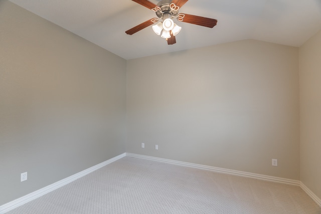 spare room with lofted ceiling, ceiling fan, and carpet floors