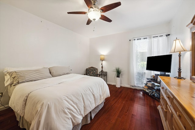 bedroom with ceiling fan and dark hardwood / wood-style flooring