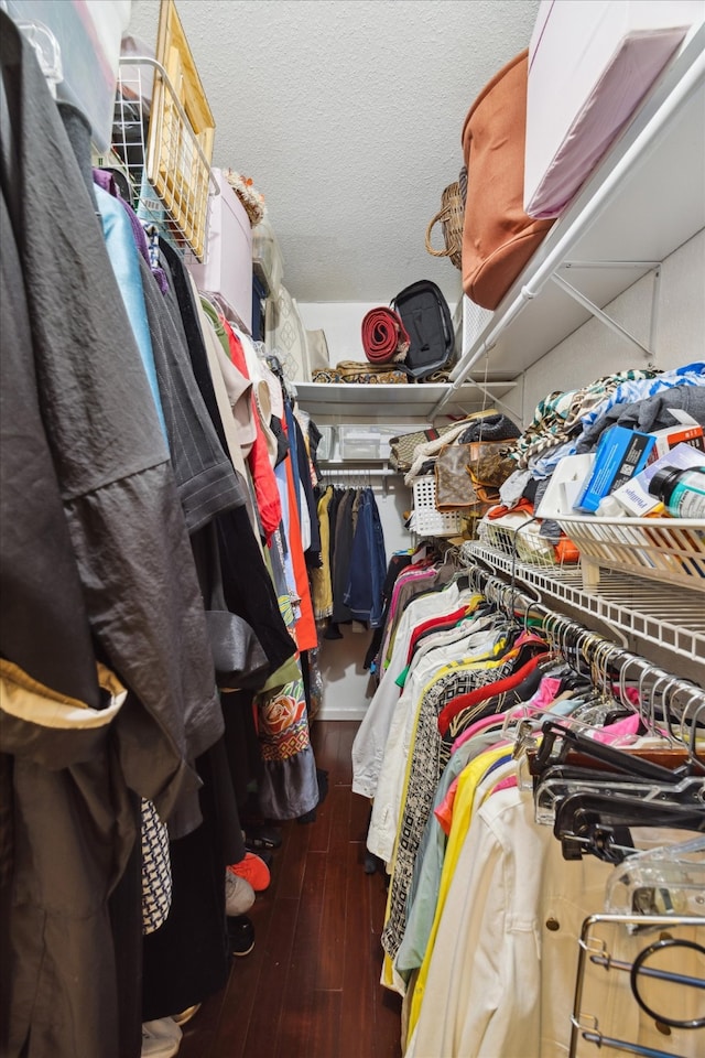 walk in closet featuring dark hardwood / wood-style flooring