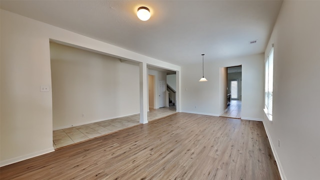 spare room featuring light hardwood / wood-style floors